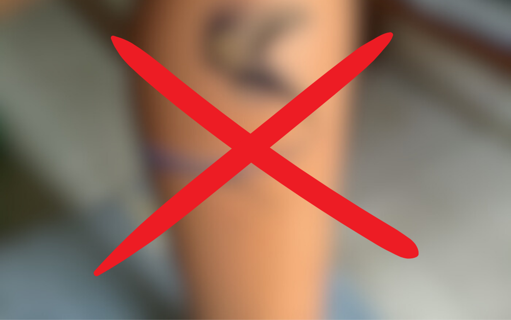 A blurred 3D lizard tattoo with a red X, symbolizing a warning against the superficial nature of optical illusion tattoos.