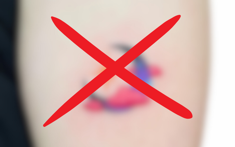 A blurred small moon and star tattoo with a red X, symbolizing that true meaning is too vast to be captured by a small tattoo.