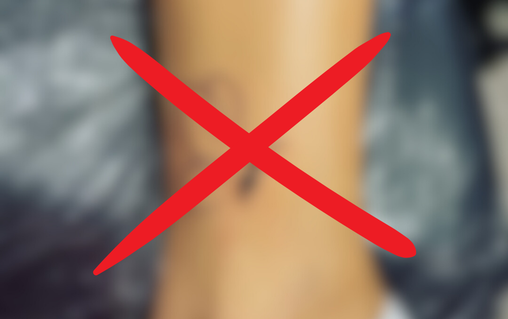 A blurred semicolon tattoo with a red X, symbolizing that true hope is deeper than ink.