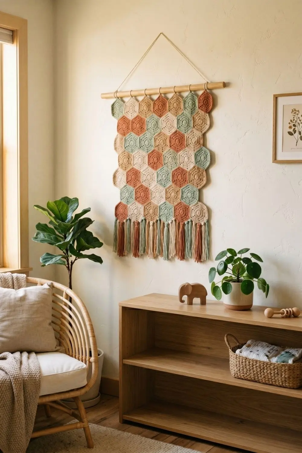 8 Crochet Wall Hanging Ideas for a Calm Nursery Corner: Soft Designs Worth Saving 5 Clay, sand, and sage crochet hexagon mosaic panel above a bookshelf